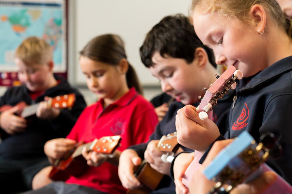 Students learn to play the guitar at West Gore School
